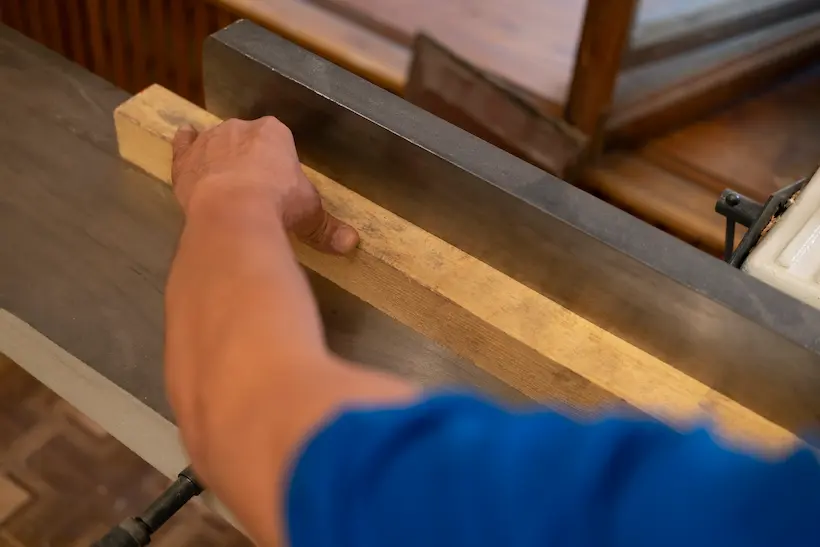 Workshop image of reclaimed timber being repurposed into furniture.